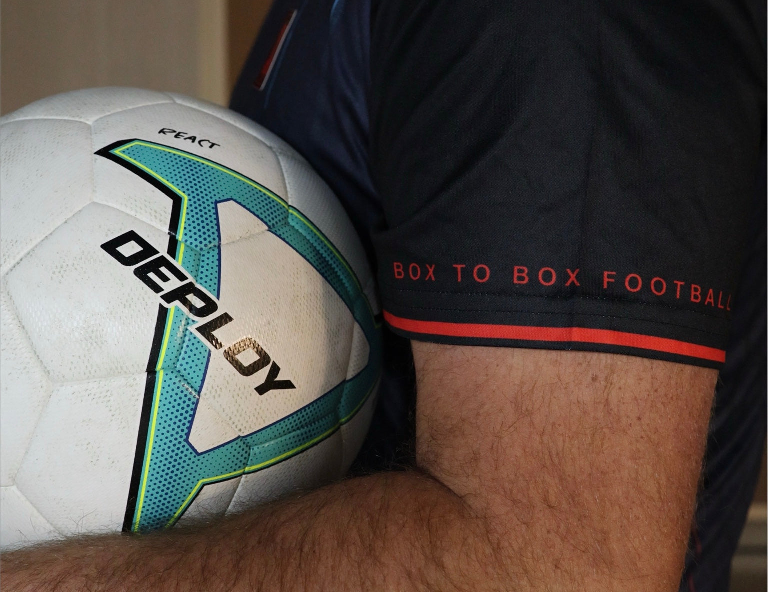 Close-up of a football and Box To Box Football sleeve detail