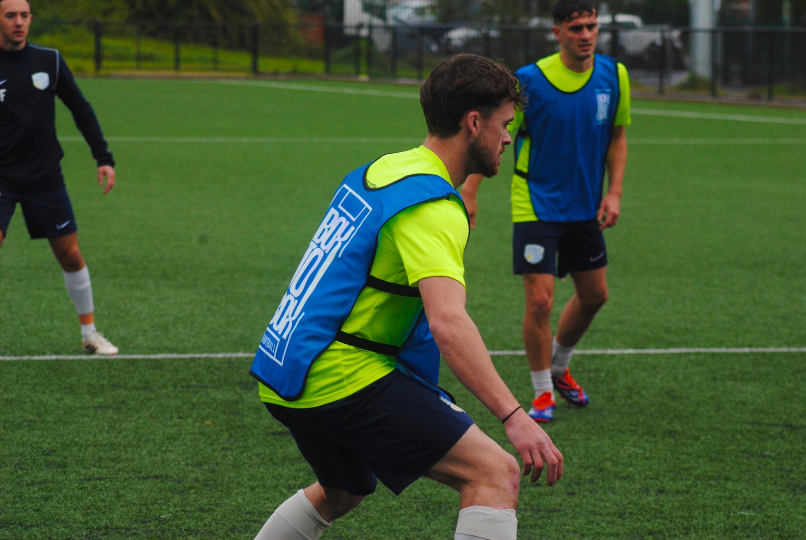 Box To Box Football training bibs being worn during a real football session