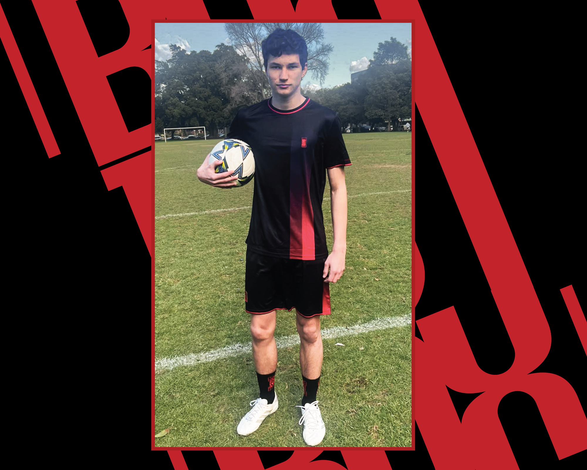 Riley Nedalkov wearing the Stealth Black training kit at a football ground